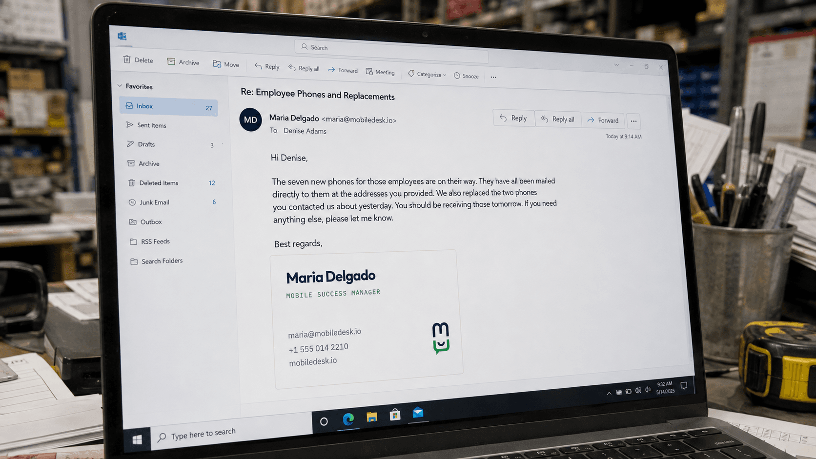 An email from Maria Delgado, Mobile Success Manager, confirming new phones are on their way and two replacements have been sent