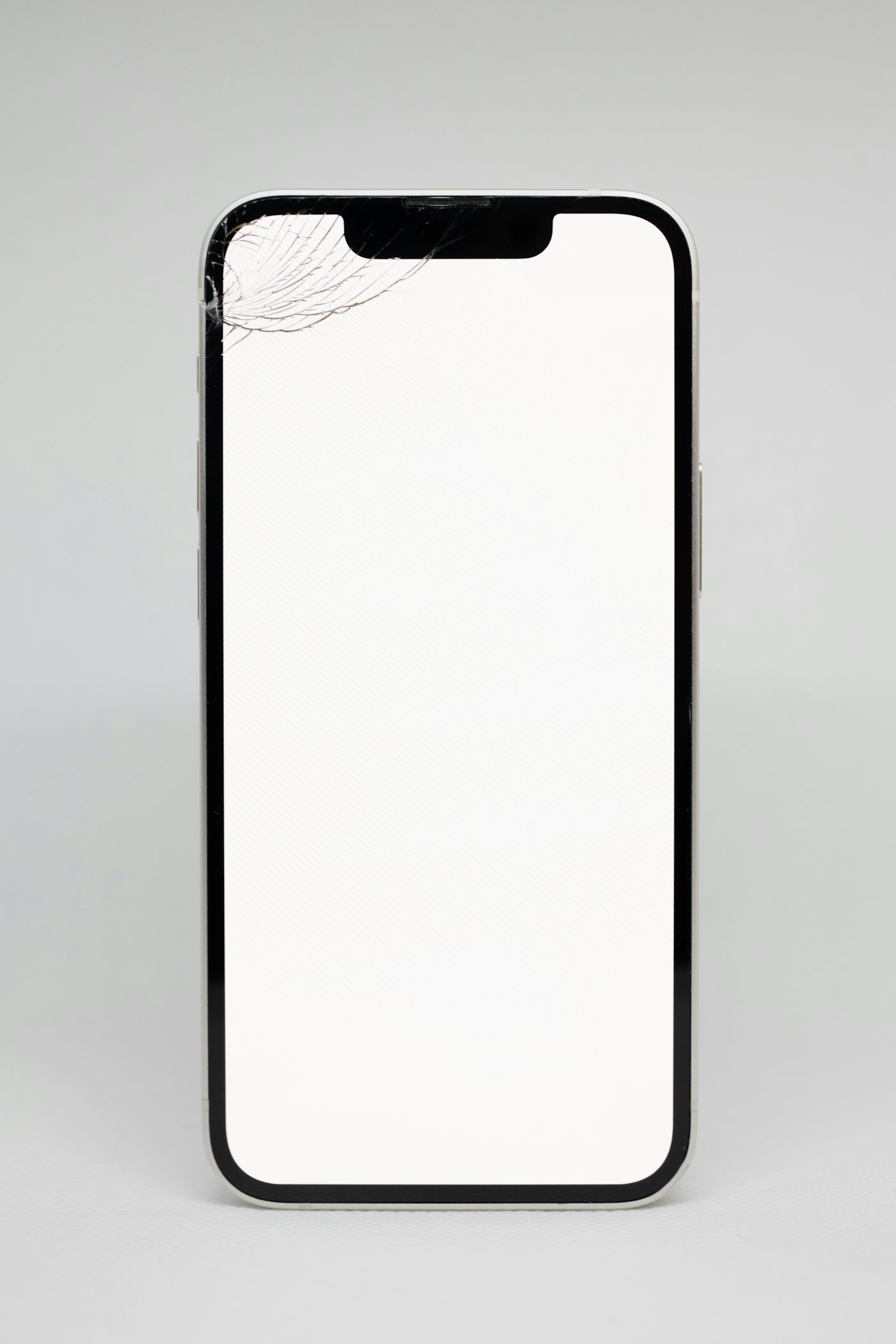 A smartphone with a badly cracked screen