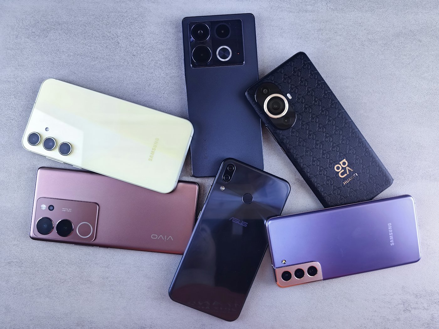 A row of company smartphones arranged side by side