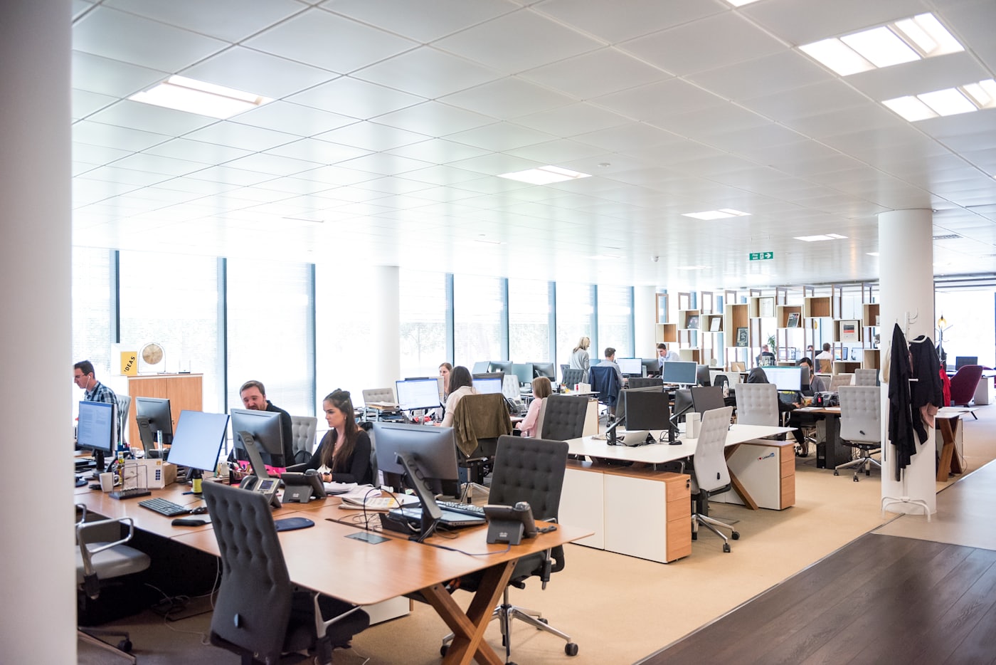 People working at desks in an open-plan office